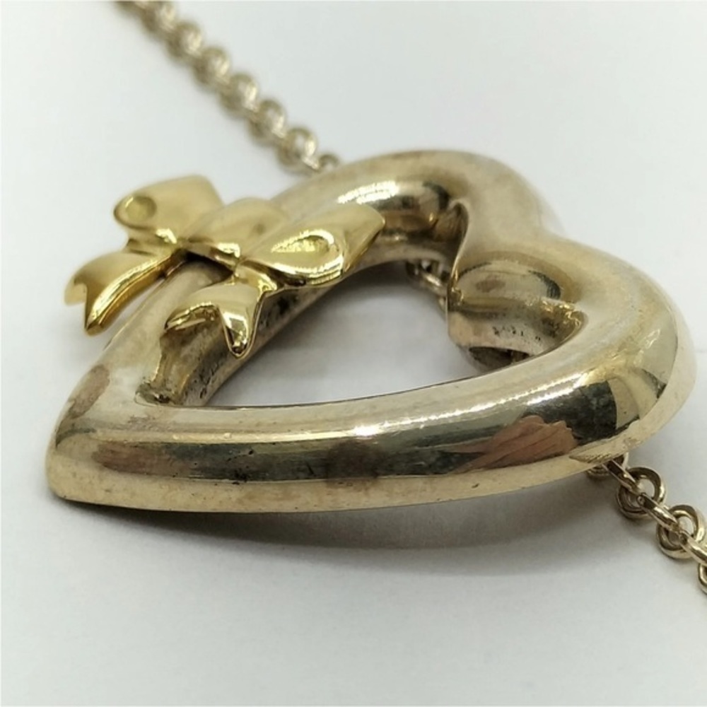 Tiffany & Co Silver Heart with 18kt Gold Ribbon Bow Necklace - Picture 9 of 11